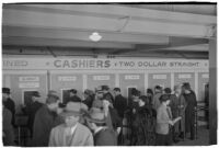 Spectators place their bets on opening day of Santa Anita's fourth horse racing season, Arcadia, December 25, 1937