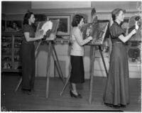 Three women practice their painting skills at the Otis College of Art and Design, Los Angeles, 1930s