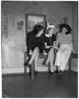 LaVerne Andre, Gladys Jackson, and Virginia Duffy sit on a table, Los Angeles, 1930s