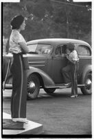 Drive-in waitress taking an order from a customer, Los Angeles, 1937