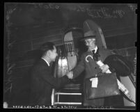 T. K. Chang, Chinese Consul to Los Angeles, Calif., greeting delegate Li Yu Ying upon his arrival to the United States in 1941