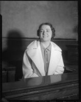 Evangelist Rheba Crawford smiling on the witness stand, Los Angeles, 1935