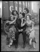 Circus girls tease Officer Ted Stewart, Los Angeles, 1935