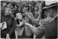 Nile Shrine members collecting relief from passersby, Los Angeles, 1938