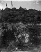 Sign warns pedestrians and drivers of landslide danger near the Figueroa St. tunnel, Los Angeles, November 1937