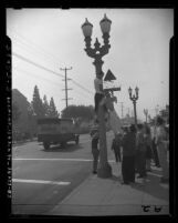 John C. Fremont High School students hanging effigy from lamp post in protest over enrollment of black students in Los Angeles, Calif., 1947