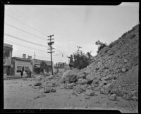 Woman stands on debris from the Elysian Park landslide, Los Angeles, November 1937