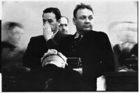 Police Captain Earle E. Kynette, Officer Roy J. Allen, and Officer Fred A. Browne stand in court after being charged with conspiracy to commit murder, Los Angeles, 1938