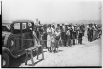 Crowd gathers to catch a glimpse of the airplane that set a world record, flying non-stop from Moscow to southern California. July 14, 1937