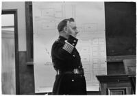 Police Chief James E. Davis being sworn in before the grand jury during the investigation of the attempted murder of Harry Raymond, Los Angeles, 1938