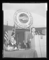 Nelson Rockefeller speaks at AFL convention as union President George Meany looks on, 1963