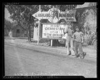 Two WPA workers hitchhiking besides Highland Springs Resort and cherry orchards billboard, Beaumont, circa 1939