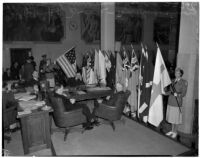 Military officials gather for a celebration of the American flag during a military show for National Defense Week, Los Angeles, 1940