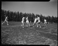 Female U.C.L.A. students playing soccer in a field, Los Angeles