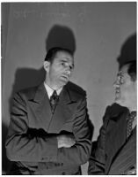 Peter Pianezzi with his lawyer Nathan O. Freedman, at a trial where he is charged with the murders of George (Les) Bruneman and Frank A. Greuzard, Los Angeles, 1940s