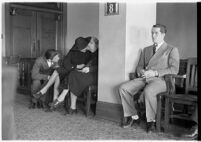 Private detective Pearl Antibus appears in court with her daughter Norma Thelan and son Robert Antibus during her trial against millionaire Thomas W. Warner, Sr, Los Angeles, 1938