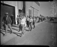 Men marching at the Douglas Aircraft Corporation plant where workers participated in a sit-down strike, Santa Monica, 1937