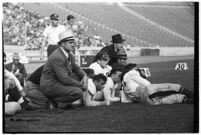 Loyola Marymount Head Coach Tom Lieb watches his team play against the Santa Clara Broncos, Los Angeles, 1937