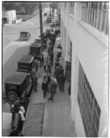 Members of the Worker's Alliance at 22nd and San Pedro Streets protesting a 40% cut to checks given out to S.R.A. relief workers, Los Angeles, February 27, 1940