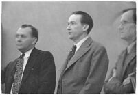 Murder suspect Robert S. James standing between two unidentified men in court, Los Angeles, 1936