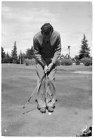 LA Daily News city editor Charles Judson demonstrates improper golf swings for a tutorial series with golfer Fay Coleman. Circa 1940