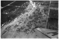 Aerial view of rushing flood waters destroying homes and crops in North Hollywood, Los Angeles, 1938