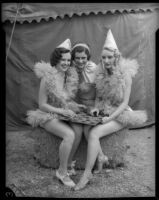 Circus girls laugh over a game of checkers, Los Angeles, 1935