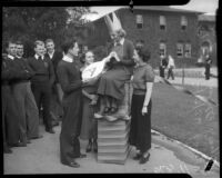 Female student crowned during paddle day at Los Angeles Junior College, February 1936