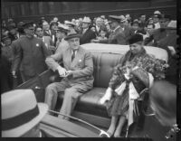 President Franklin D. Roosevelt and Eleanor Roosevelt sit in open air car at start of motorcade tour of Los Angles, October 1, 1935