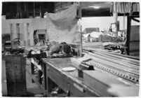 Man sleeping at the Douglas Aircraft Corporation plant where workers participated in a sit-down strike, Santa Monica, 1937