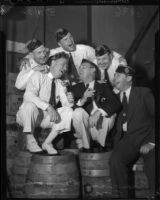American Legion members pose, singing atop barrels, during the 1936 California state convention