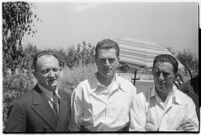 Russian aviators meet the press after breaking the non-stop flight record, flying from Moscow to San Jacinto, CA. July 14, 1937