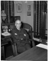 Republican politician Arthur M. Hyde sitting at a desk, Los Angeles, 1940