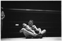 Heavyweight wrestler Vincent López grappling with newcomer El Pulpo at the Olympic, Los Angeles, 1937