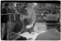 Patrons playing cards in a casino, Los Angeles, 1937