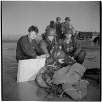 Military personnel participating in the Army-Navy maneuvers that took place off the coast of Southern California in late 1946