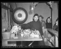 Charlie Chan, fortune teller, in Chinatown, Los Angeles, circa 1940