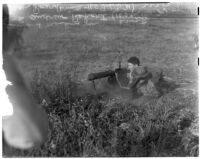 Soldiers display a standard machine gun during a military show for National Defense Week, Los Angeles, 1940