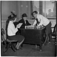 Betty Redd, O.E. Hanson, and Howard Blez in costume for Anaheim's annual Halloween festival, Anaheim, October 31, 1946