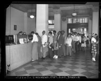 Veterans waiting in line at Bank of America to cash bonds during G.I. bond "gold rush" in Los Angeles, Calif., 1947