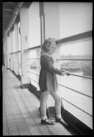 Little girl looking out to the harbor on the S.S. Mariposa, Los Angeles