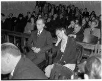 Betty Hardaker, mother convicted of murdering her daughter, sits with her brother Samuel Karnes, Jr. in a courtroom, Los Angeles, 1940