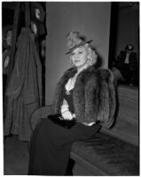 Mae West sitting in court during questioning about earnings from her role in the movie "She Done Him Wrong," Los Angeles, 1940