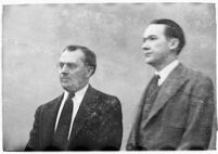 Murder suspect Robert S. James standing between two unidentified men in court, Los Angeles, 1936