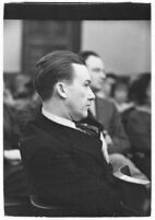 Widower Robert S. James sitting in a courtroom during an inquest involving his wife's death, Los Angeles, 1935