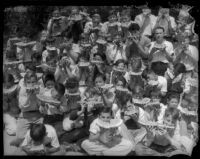 Thomas Starr King Junior High boys eating watermelons, Los Angeles, 1934