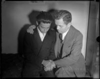 Louis Rude Payne is comforted by his father Lucius Payne on the day of his inquest. June 6, 1934