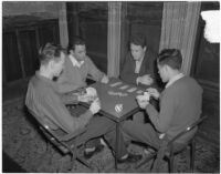 USC Kappa Alpha members play a card game inside their fraternity house, Los Angeles, 1940