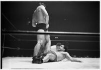 Heavyweight wrestler El Pulpo grappling with an opponent at the Olympic Auditorium, Los Angeles, 1937