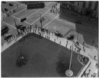 Pickets from the Workers Alliance protesting relief check cuts outside the State Building during S.R.A. hearings, Los Angeles, March 5, 1940